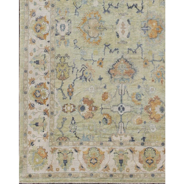 Long Oushak Rug in Light Green by Keivan Woven Arts 10'9 x 16' Measures: 10'9 x 16'. Turkish Oushak rug light green and...
