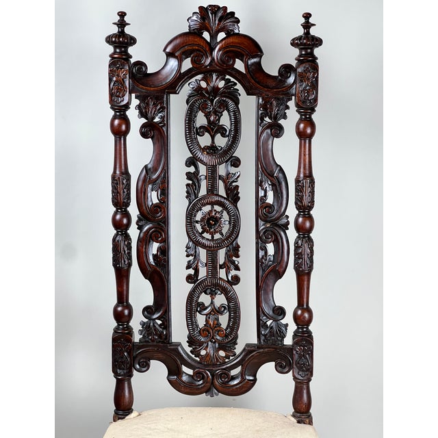 This exceptional late 17th century Flemish side chair is finely carved with an architectural presence that reflects the...