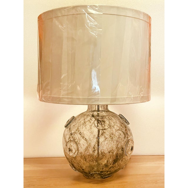 Originally designed in the 1930s, this Art Deco Murano glass table lamp is a wonderful creation by Barovier & Toso. This...