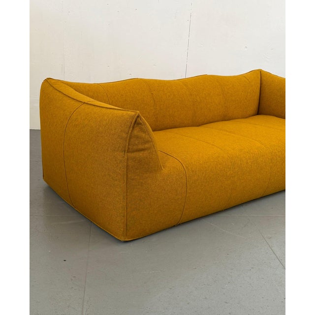 Mario Bellini's Le Bambole arrived in 1972 like a dare: what if a sofa were just a pillow, blown up to room scale, with...