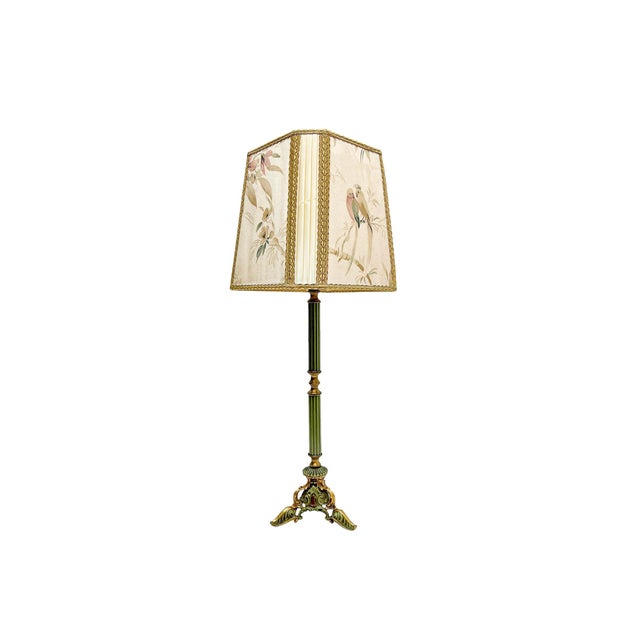 A Louis XV/Rococo table lamp on a richly decorated polychrome tripod base, featuring a fluted column. The colours are...