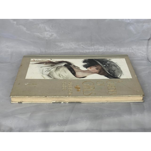 With Harrison Fisher color lithograph prints interspersed with poetry about women, this large-format antique book is a...