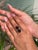 Handcrafted in 925 Sterling Silver, this ring highlights the beauty of garnet with two oval-cut stones weighing 8.47...