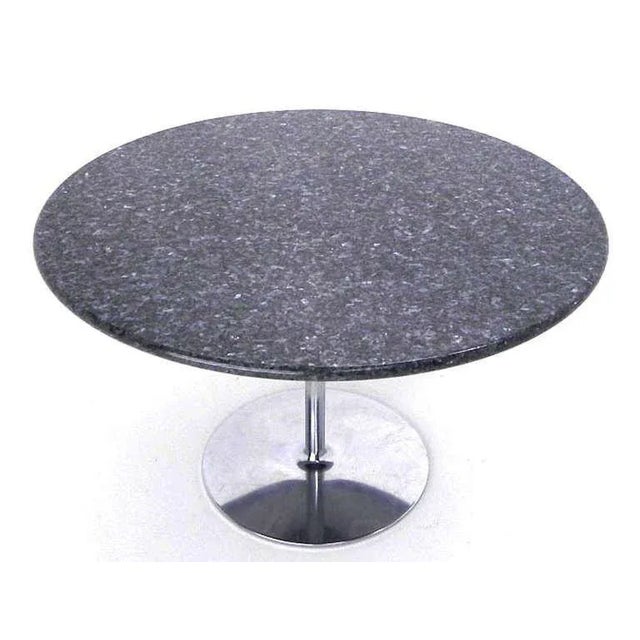 Tulip chrome base granite top round dining dinette or small conference table. Made in the early 20th century.