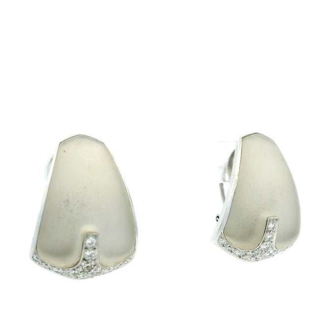 A striking pair of vintage Italian earrings crafted in 18 karat white gold, designed with a bold yet refined sculptural...