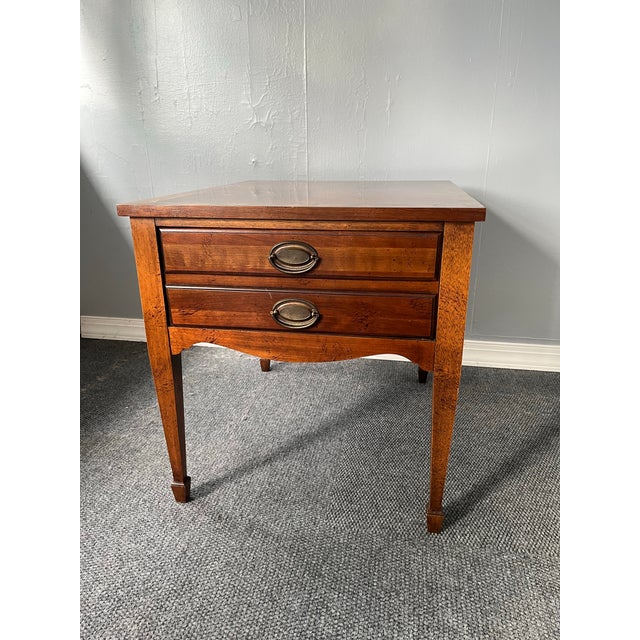 A refined Federal Style mahogany side table by Lane, distinguished by its beautifully executed marquetry top. The...