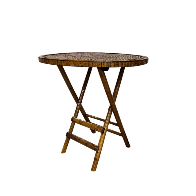 Vintage round tortoise bamboo and woven rattan folding bistro table. Collapses to 28” diameter x 5” d x 30” for easy...
