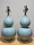 A very charming pair of modern double gourd Porcelain lamps in a crackle glaze with lucite bases and single brass hardware.