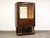 An Art Deco display cabinet designed by French designer Christian Krass made with macassar wood and brass details....