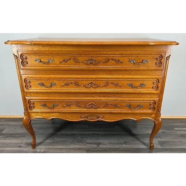 The chest of drawers \.sideboard has three drawers , the drawers are decorated with wonderful carvings, it rests on...