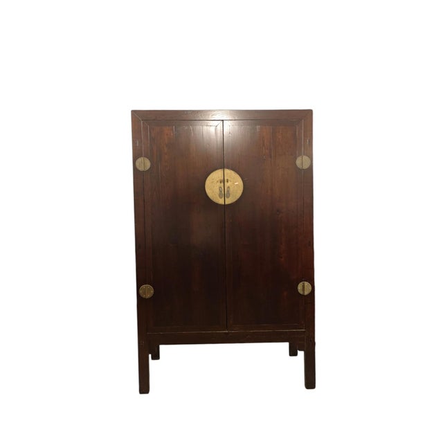 This 19th century antique cabinet features a classic, gently tapered design with a rich reddish-brown finish that...