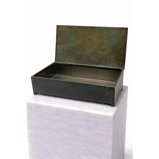 A refined bronze lidded box designed by Sune Bäckström, Sweden, 1930. The piece reflects the early development of...