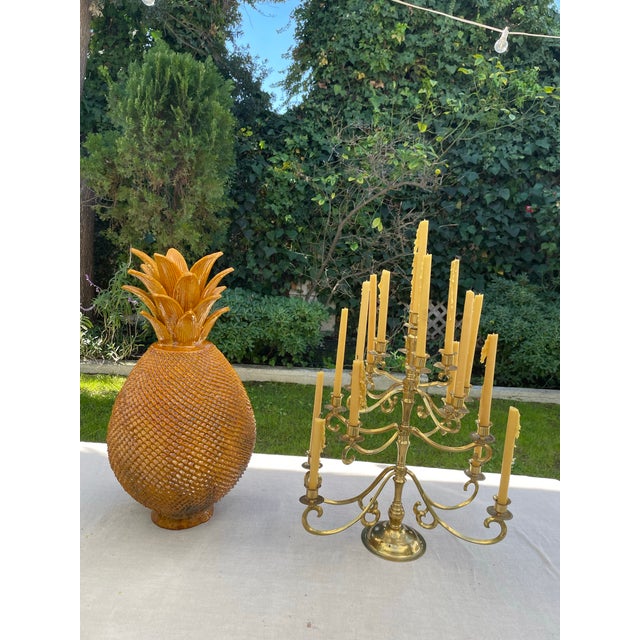 Elegant and substantial vintage brass candelabra featuring multiple scrolling arms arranged in a tiered design. This...