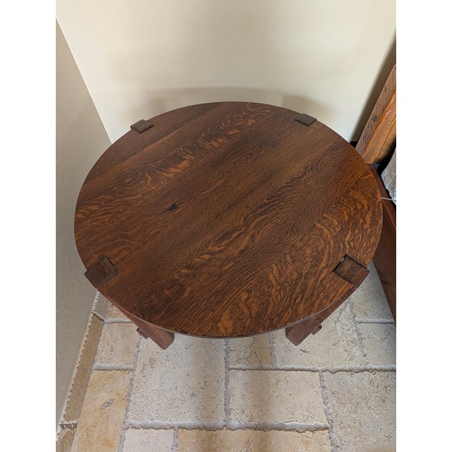 A hallmark of the Arts and Crafts movement from the early 20th century. This piece showcases the natural beauty of solid...