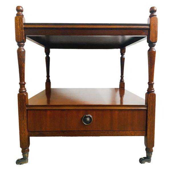 Beautiful vintage classic English Country style side table has the original brass casters and is made with a combination...