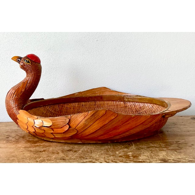 Add a touch of whimsy and artisanal craftsmanship to your home with this delightful vintage wicker duck basket. Hand-woven...