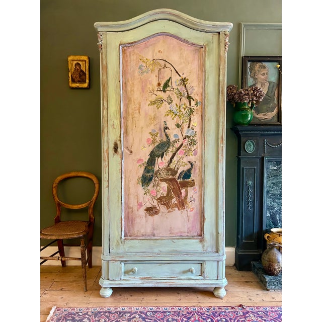 Beautiful vintage linen cupboard, we have added a peacock chinoiserie door panel with a aged patina.