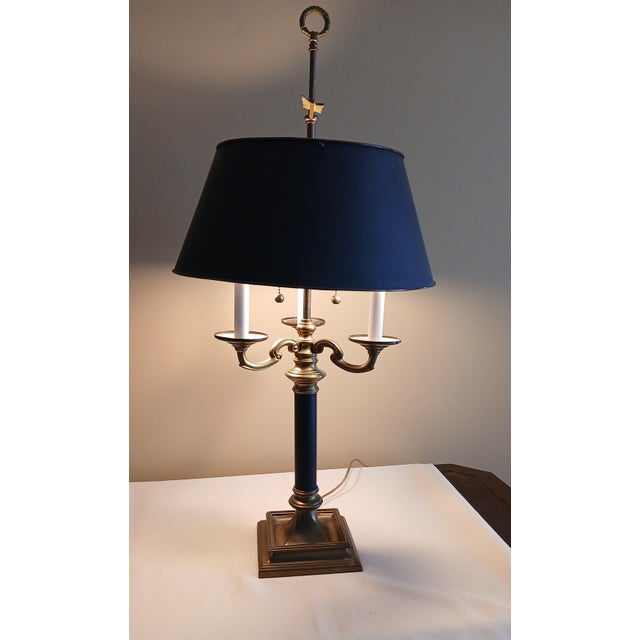 The vintage brass Bouillotte table lamp is a stylish and classic addition to any room. This lamp has a brass base and a...
