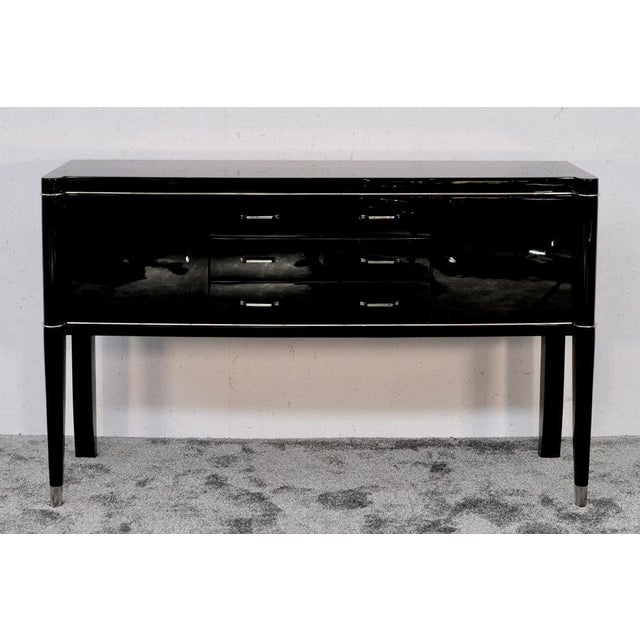 The surface was completely refinished in high-gloss black lacquer, the interior was left in its original condition, and...