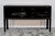 The surface was completely refinished in high-gloss black lacquer, the interior was left in its original condition, and...