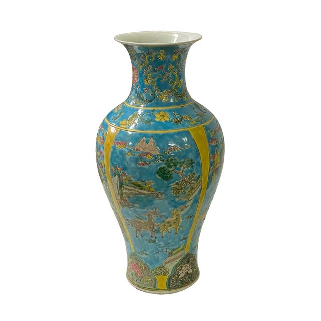 This Chinese decorative blue yellow base porcelain vase has a hand-painted color graphic of Phoenix, Kirin, animals...