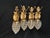 A rare and decorative set of four French Louis XVI-style wall lamps / sconces, crafted circa 1970 from gilt bronze with...