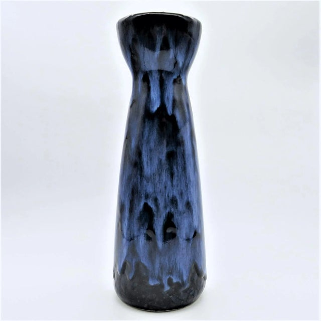 Mid-century West German ceramic vase with blue on blue drip high gloss glaze, with a high waist shape. Manufactured by...
