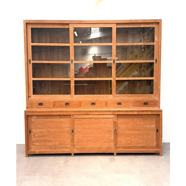 Impressive large teak display and storage cabinet , combining an expansive glazed display section with generous closed...