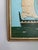 This seascape pairs a robin’s egg blue sky with an army green foreground and vessel, softened by off-white sails. A small...