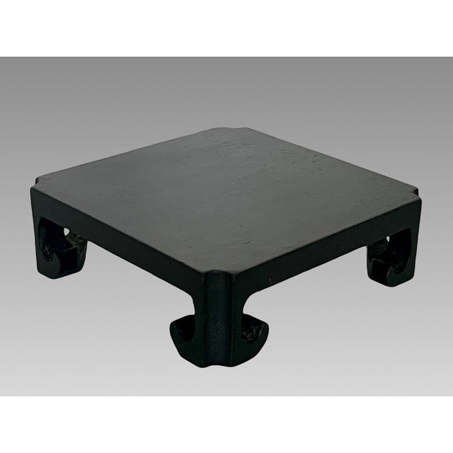 A square dark brown solid wood stand for displaying a vase, carvings, statues or any of your treasures. Flat top that will...