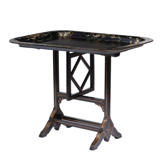 Rectangular paper mache tea tray table with a flat rim and rounded corners. The tray has a hand painted scroll work &...