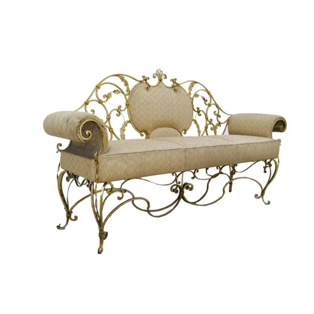 This sofa has an iron structure and features its original fabric.