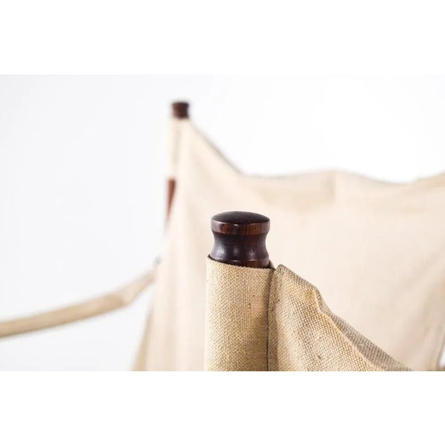 A pair of Danish mid-century ‘safari’ chairs designed by Erik Wørts for Niels Eilersen, model no. 30 was produced in the...