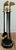 Vintage four piece brass and iron fireplace tool set on stand. Each handle topped with a golf club on round stand topped...