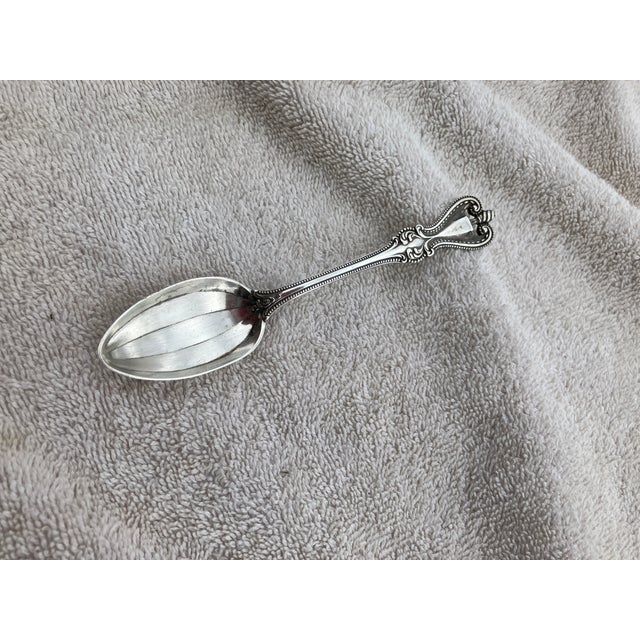 Lovely teaspoon with 5 fluted bowl . date 1906 is engraved on front. The name Grace is engraved on back. Also marked...