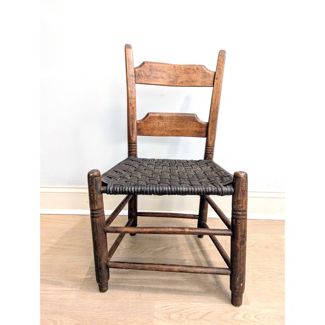What a rare and exceptionally charming piece of 19th century Americana! This antique Shaker-style ladderback child's chair...