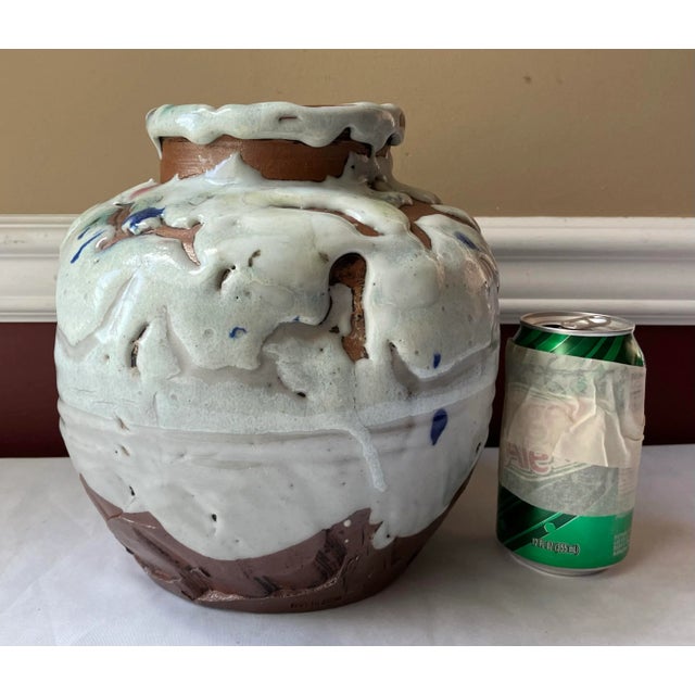 This striking vintage Japanese vase showcases bold sculptural texture and flowing glaze work, echoing the artistry of...