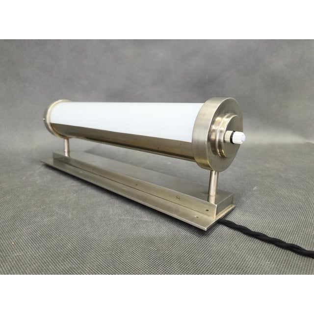 Original Bauhaus wall light manufactured in Czechoslovakia in the 1930s. This refined functionalist design features a...