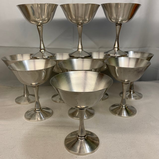 This is a tiered display of This is a tiered display of vintage silver-plated champagne coupe / dessert sherbet goblets,...