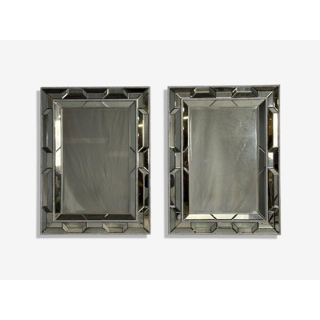 French Art Deco, Large Venetian Wall Mirrors, Antiqued Glass, Silver Leaf Wood, 20th c. Pair of large geometric...