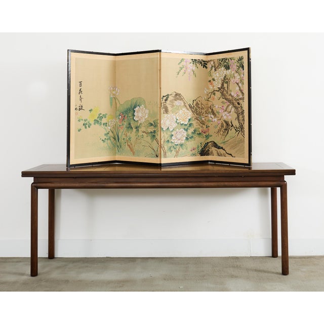 Colorful Asian four panel folding byobu screen depicting a vibrant spring floral landscape of various flowers. The...