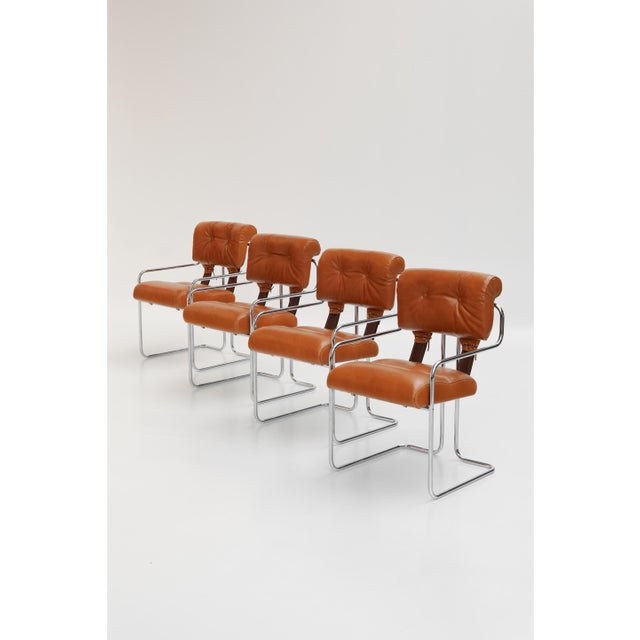 Tucroma chairs designed by Guido Faleschini for i4 Mariani. They combine a chromed metal frame with a cognac-colored...