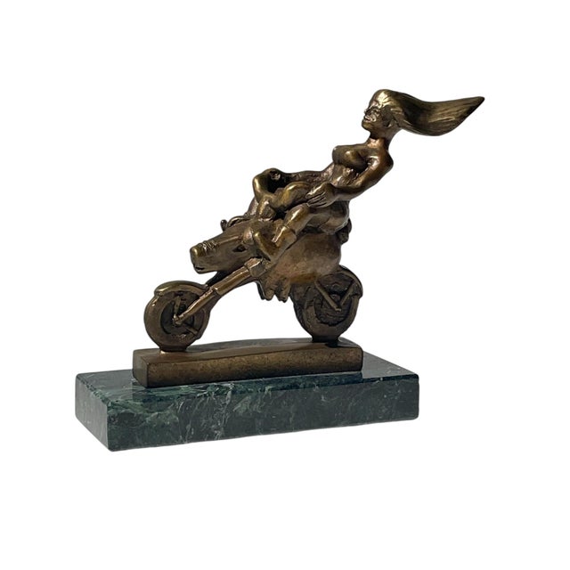 A fine and rare collaboration bronze sculpture on a green marble base, depicting a hog motorcycle titled “Cruising“ by...