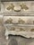 Elegant Louis XV style commode featuring a graceful bombe-shaped silhouette, three spacious drawers, and ornate gilt...