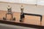 A decorative pair of French fireplace andirons, or fire dogs, dating from around 1920. Each piece is constructed from...