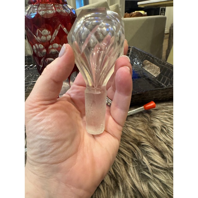 Bohemian cranberry glass decanter - with elaborate cut glass design. These pieces were highly sought after for their...