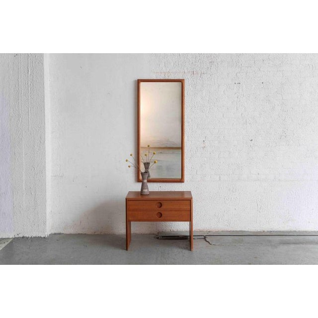 Large mirror, designed and produced by Vildbjerg Mobelfabrik, Denmark during the 1960’s. This teak piece with elaborate...