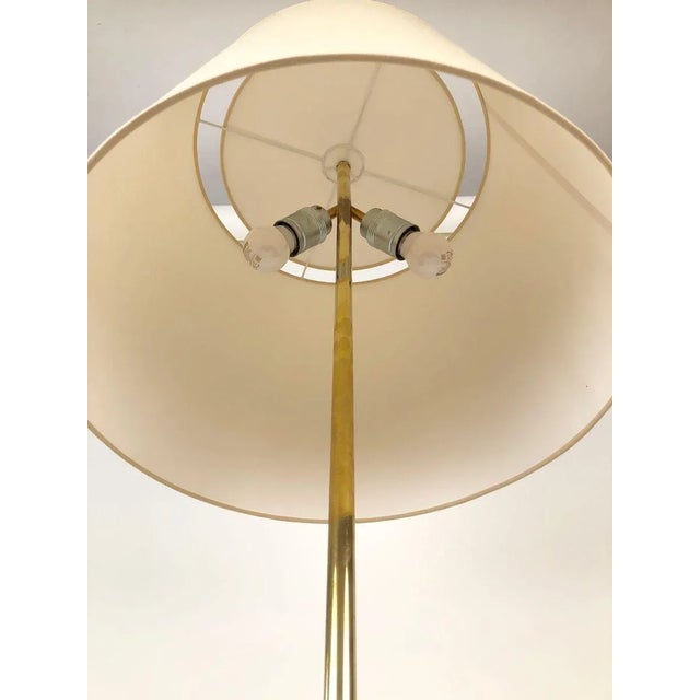 A tripod floor lamp, model no. 2003 from j.t. Kalmar, was manufactured between 1930 until 1960. This was a very popular...