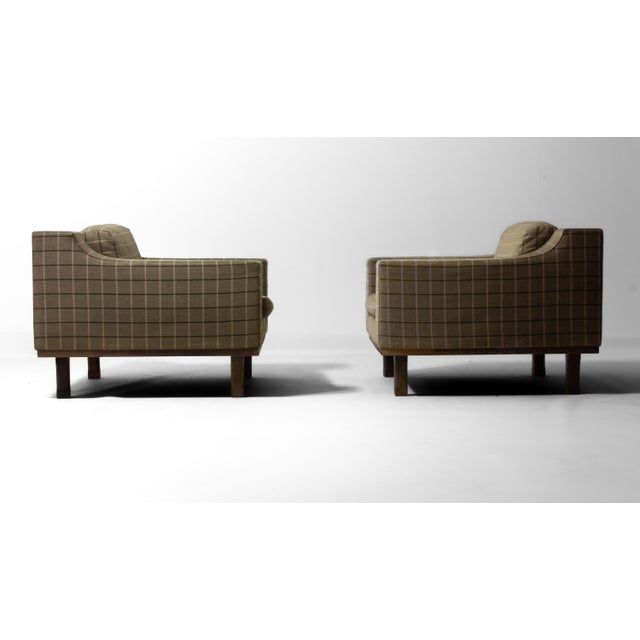 Set of 2 club lounge chairs by Dino Cavalli, Italy, 1970s. Wooden frames with a low, rounded square profile and integrated...