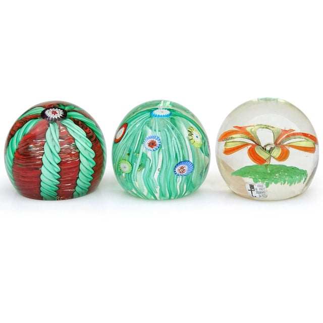 Beautiful, set of 3, vintage Murano hand blown flower design Italian art glass paperweights. They are documented to the...